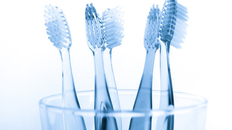 Toothbrush Cleaning Tips — Peak Dental - Logo